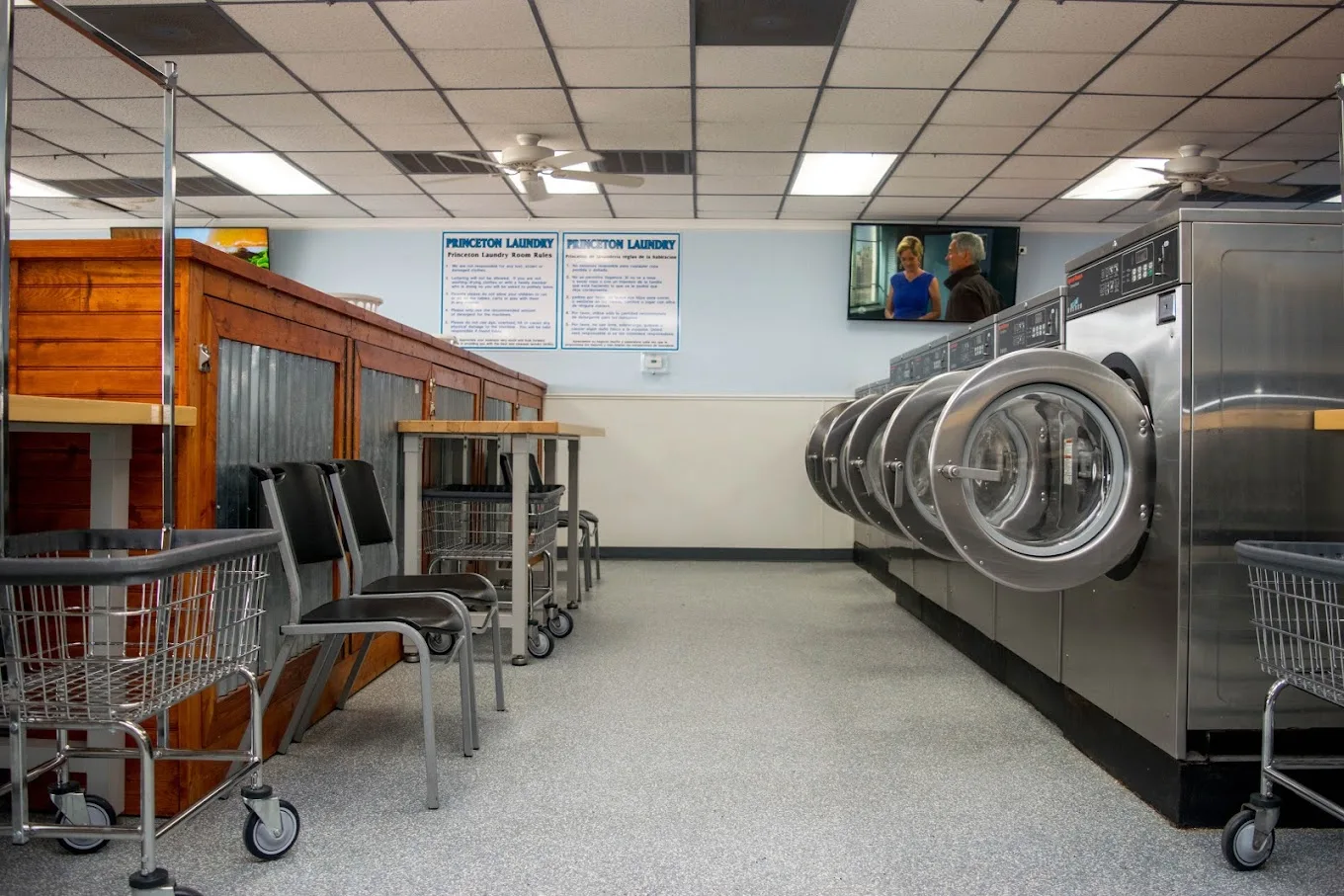 Rows of washers and dryers inside Princeton Laundry