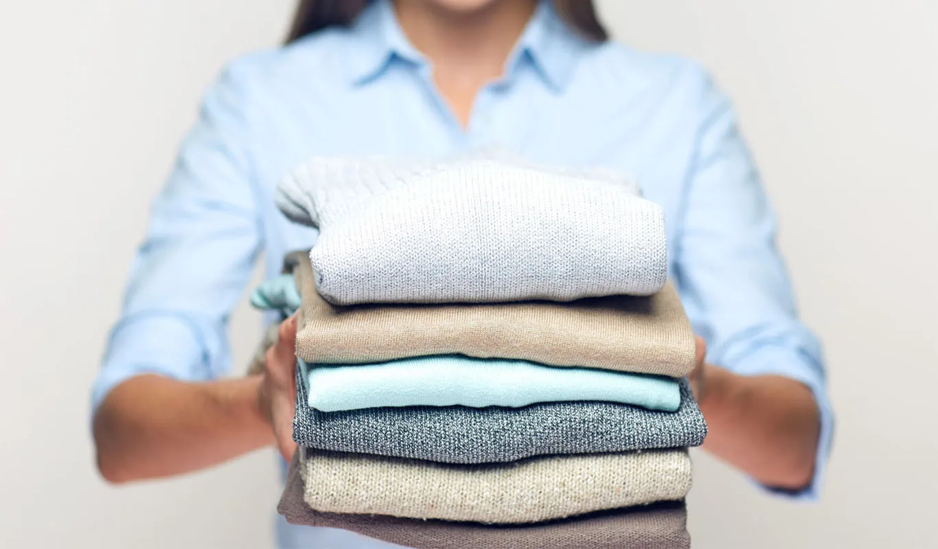 A neatly folded stack of clean clothing