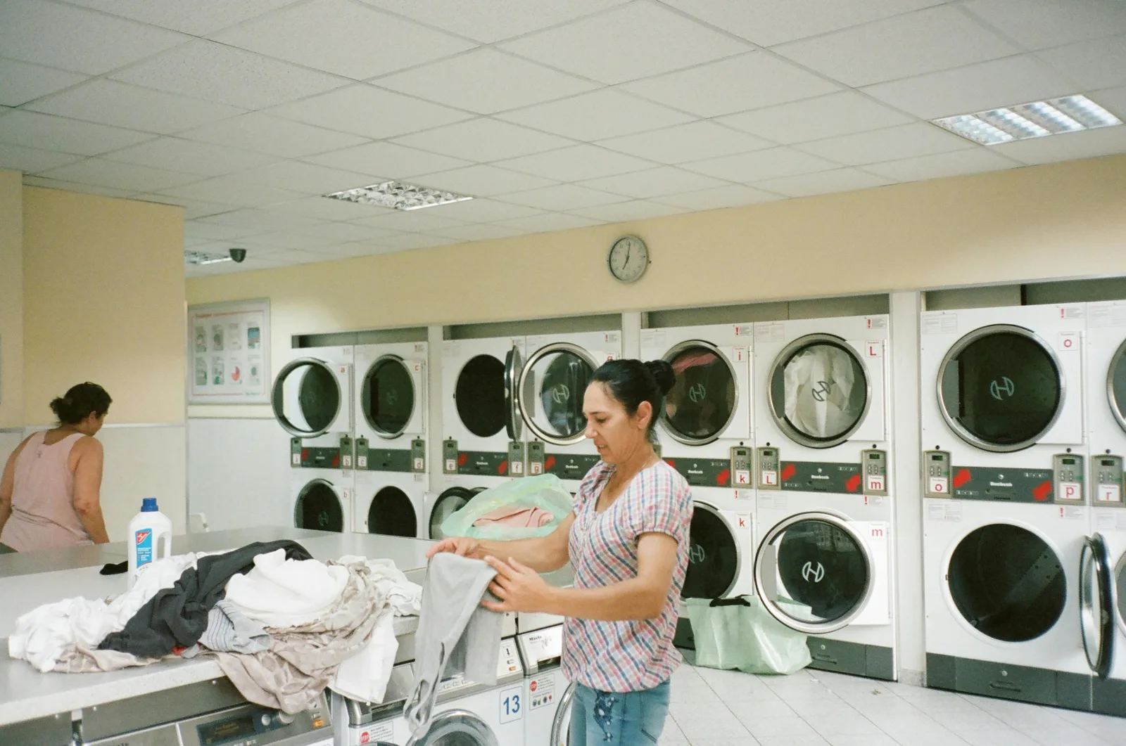 Princeton Laundry team members inside the laundromat